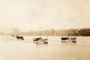 Parade of Blanchard boats past the yard at 3201 Fairview Ave